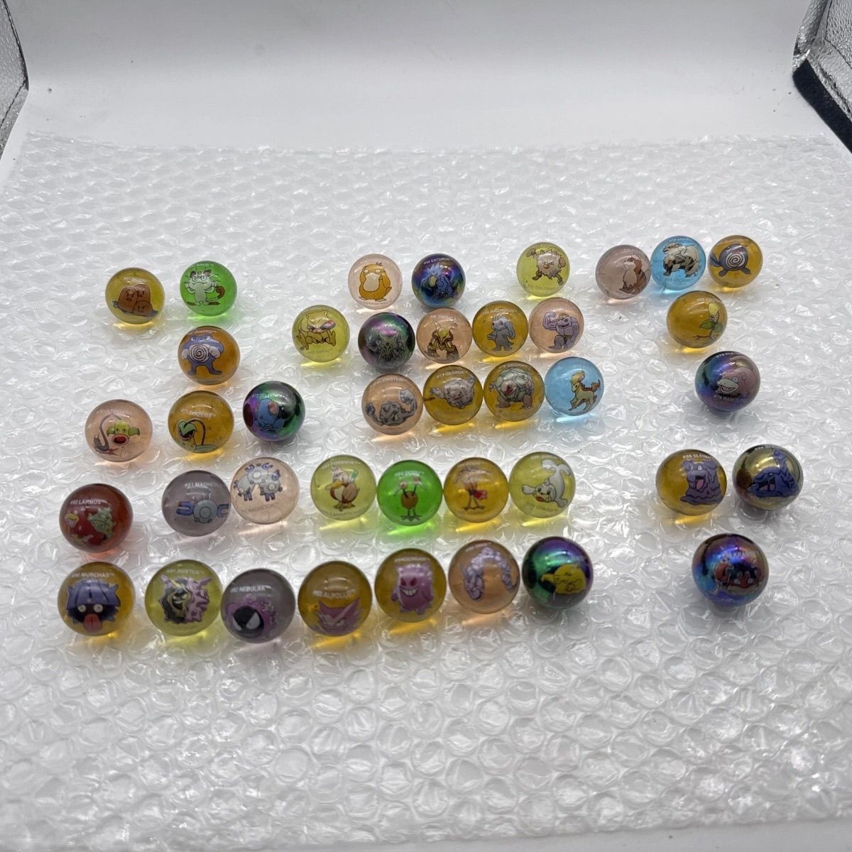 Mercancía Oficial de Pokémon,  - Vintage Collectible Marbles reseña y precio